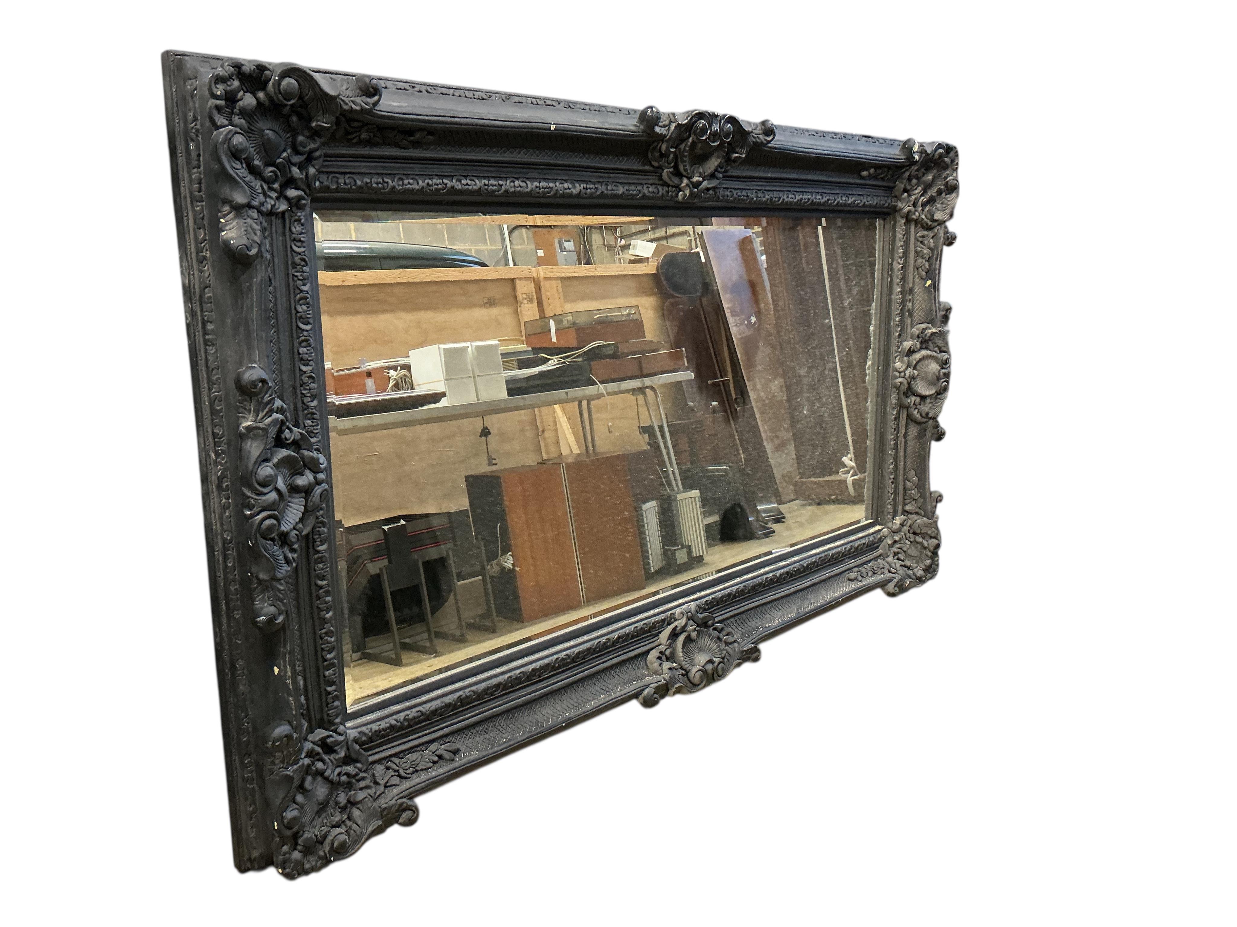 A large Victorian style 'Heritage' rectangular black painted wall mirror, width 226cm, height 136cm
